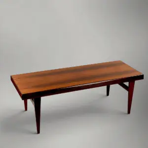 Stemplet Niels Bach A/S model 54 sofabord i palisander med skuffe og udtræksplade med sort formica.
